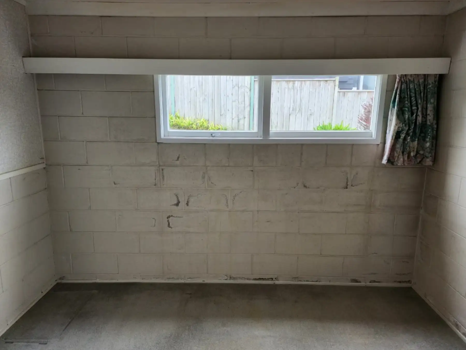Existing rumpus room before bathroom conversion