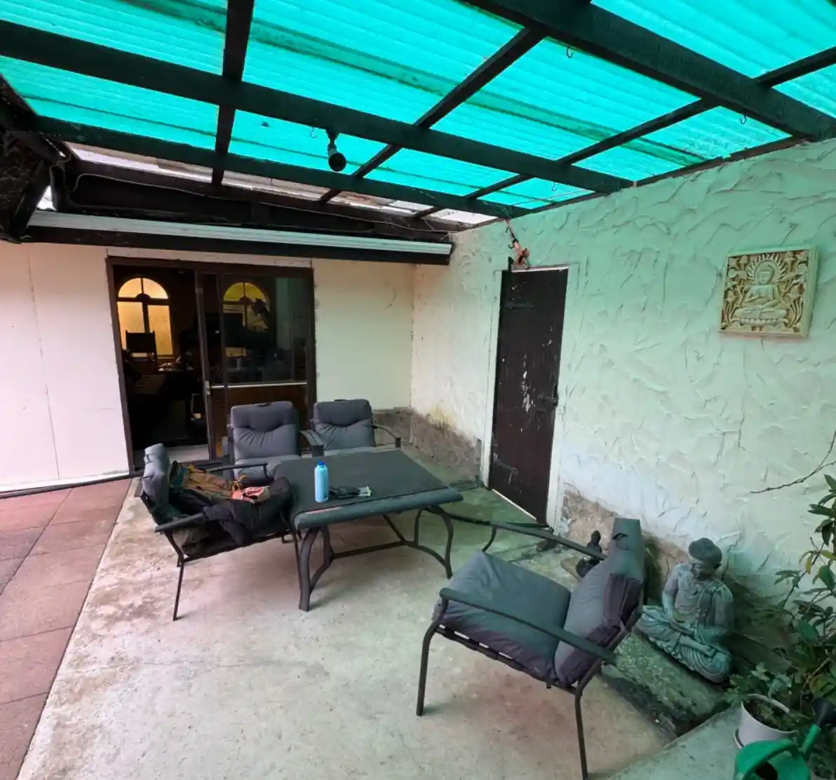 Existing covered patio before becoming an enclosed deck connection