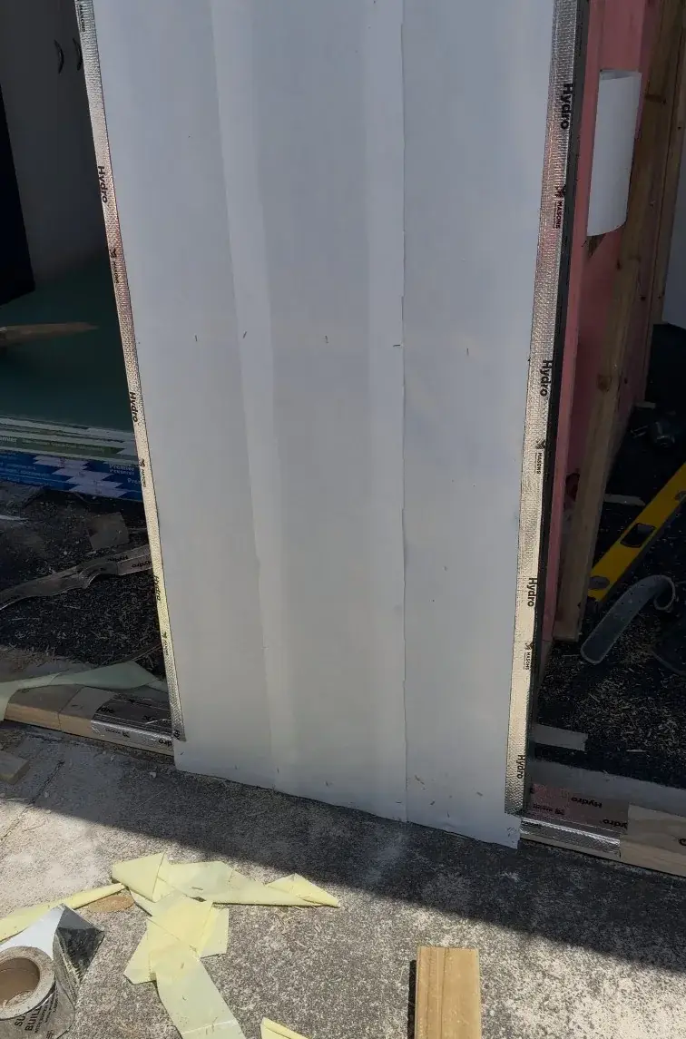 New framed wall installed where the garage door had been removed